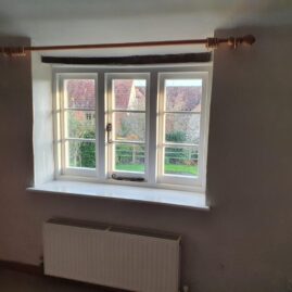Interior view of bespoke Accoya timber windows with From The Anvil ironmongery in Stoke St Gregory Somerset