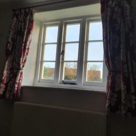 Interior view of bespoke Accoya timber windows with From The Anvil ironmongery in Stoke St Gregory Somerset