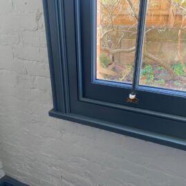 Bespoke hardwood box sash window with traditional margin bars and dual-colour finish in Somerset